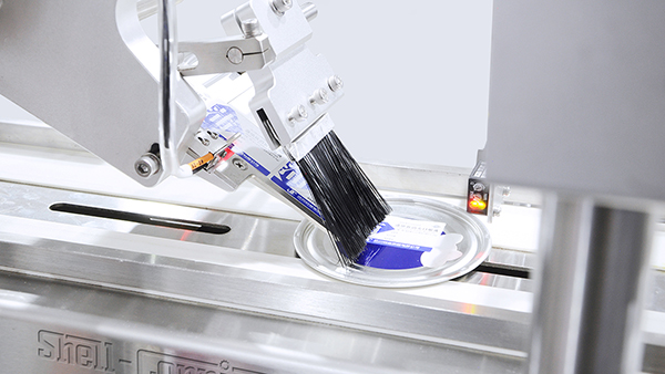 青蛙王子高速分页平面贴标机合作案例